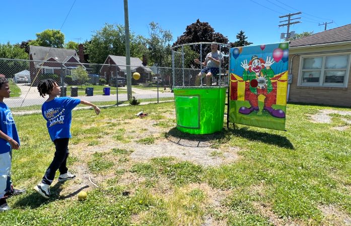  Student throwing ball for the dunking booth